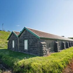 Long bluestone store with buttresses at Jack’s Magazine in Maribyrnong, Australia, a former Oddtoe fabrication and design space